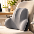 Coussin ergonomique gris sur chaise de bureau